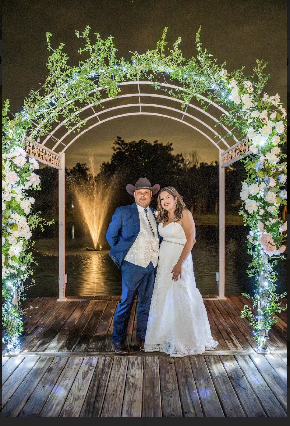 Crystal chandelier and ceiling canopy draping inside ballroom